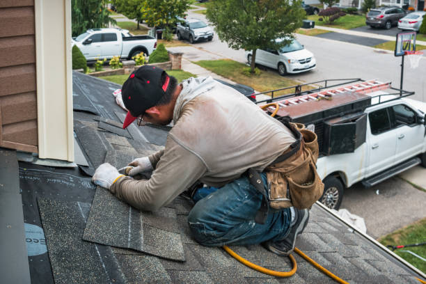 Professional Roofing technician working in Northwood, IA